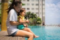 Fun family pool time with mother and child. Vacation time Royalty Free Stock Photo