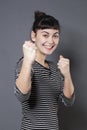 Fun fighting concept for excited 20s woman Royalty Free Stock Photo