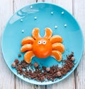 Fun food art for kids - tangerine spider on a blue plate