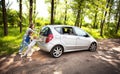 Fun friendly family is on a picnic. A car breakdown.