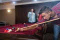 Fun with friends during playing billiard Royalty Free Stock Photo