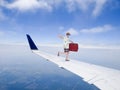 Fun and Funny Tourist Travel Flying on Airplane Jet Wing Royalty Free Stock Photo