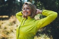 Fun girl exercising outdoors in sun summer day, smile fitness woman stretching exercises training outside in park. Happy sportswom Royalty Free Stock Photo