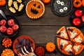 Fun Halloween dinner party frame over a dark wood background Royalty Free Stock Photo