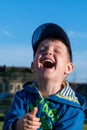 A fun, happy little boy laughs very much. Royalty Free Stock Photo