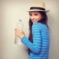 Fun happy woman in summer hat drinking pure water from bottle. T Royalty Free Stock Photo