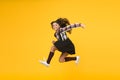 Fun and jump. Happy childrens day. Jump concept. Break into. Feel inner energy. Girl with long hair jumping on yellow Royalty Free Stock Photo