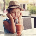 Fun kid girl in hat screwing up her eyes and waiting the moment Royalty Free Stock Photo