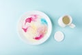Fun kids science experiments. Step by step instruction: how to make colorful stains in milk. Step2 pour milk into a plate and add