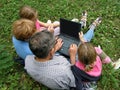 Fun with a laptop in picnic Royalty Free Stock Photo