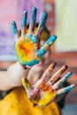 Fun leisure artist hands blue yellow paint