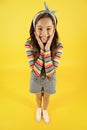 Fun lifestyle little girl long hair denim overalls, summer concept Royalty Free Stock Photo