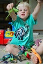 Fun Little Boy PLaying with Toys