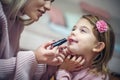 Fun with make up. Mother and daughter. Royalty Free Stock Photo