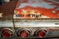 Fun message on an old rusty car - Rust In Peace