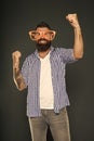 Only fun on my mind. Entertaining himself. Bearded man wearing party glasses. Funny hipster in extravagant glasses