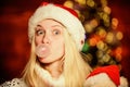 Only fun on my mind. Girl Santa claus making big bubble with gum. Funny face close up. Adorable woman blowing bubble Royalty Free Stock Photo