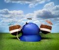 Fun outdoor summer scene with a beer helmet with coconut cocktails on a lush green grassy field Royalty Free Stock Photo