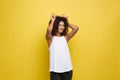 Fun and People Concept - Headshot Portrait of happy Alfo African American woman with freckles smiling and showing rabbit Royalty Free Stock Photo