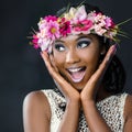 Fun portrait of attractive african bride with flower garland. Royalty Free Stock Photo