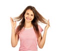 Fun prank joy entertainment concept. Silly girl playing with hairs. emotional girl isolated on white background