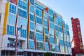 Fun and quirky building with windows at different angles in California with New Mission sign Royalty Free Stock Photo