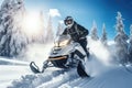 Fun ride on a snowmobile in deep snow. Outdoor sports activity during winter vacation