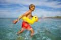 Fun at sea - boy in sunglasses swim with inflatable duck Royalty Free Stock Photo