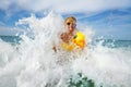 Fun in the sea - boy with sunglasses and yellow inflatable duck Royalty Free Stock Photo
