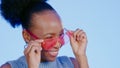 Fun, sunglasses and smile, black woman in studio with cool, trendy summer fashion and creative mockup. Happiness, luxury