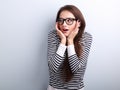 Fun surprising young woman in eyeglasses looking on empty copy s Royalty Free Stock Photo