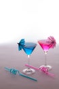 Fun vacation party drinks. Pink and blue cocktails glasses with Royalty Free Stock Photo