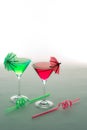 Fun vacation party drinks. Red and green cocktails glasses with