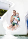 Fun on the water slide at waterpark Royalty Free Stock Photo