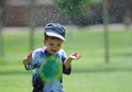 Fun with watersprinkler Royalty Free Stock Photo