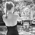 Happy active mother and daughter in swimming pool playing Royalty Free Stock Photo