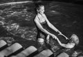 Happy active mother and daughter in swimming pool playing Royalty Free Stock Photo