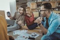 Cheerful three colleagues laughing at joke Royalty Free Stock Photo