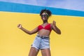 Fun young afro american woman laughing with arms raised Royalty Free Stock Photo