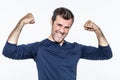 Fun young bearded man smiling, showing his motivation and muscle Royalty Free Stock Photo