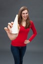 Fun young beautiful woman showing an appetizing cheese Royalty Free Stock Photo