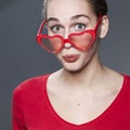 Fun young girl with heart-shape glasses Royalty Free Stock Photo