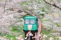 Cherry Blossom Festival at Funaoka Castle Ruin Park,Shibata,Miyagi,Tohoku,Japan on April12,2017:Slope car passing sakura tunnel Royalty Free Stock Photo