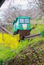 Cherry Blossom Festival at Funaoka Castle Ruin Park,Shibata,Miyagi,Tohoku,Japan on April12,2017:Slope car passing sakura tunnel Royalty Free Stock Photo