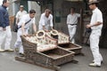 FUNCHAL, MADEIRA - MAY 20: Traditional downhill sledge trip on May 20, 2015 in Madeira, Portugal. Sledges were used as local trans