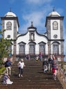 tourists on the steps of the historic Church of Our Lady of Monte in funchal with an old woman begging Royalty Free Stock Photo