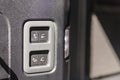 Functional button in a car trunk. Electric trunk switch controller. Car trunk electric lock button