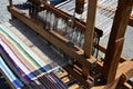 Functional historical wooden hand-loom weaving colorful mat with vertical lines displayed on festival of medieval and traditional Royalty Free Stock Photo