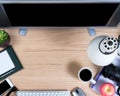 Functional office desktop in overhead view on oak wood