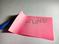 fund text displayed on pink paper slip Royalty Free Stock Photo